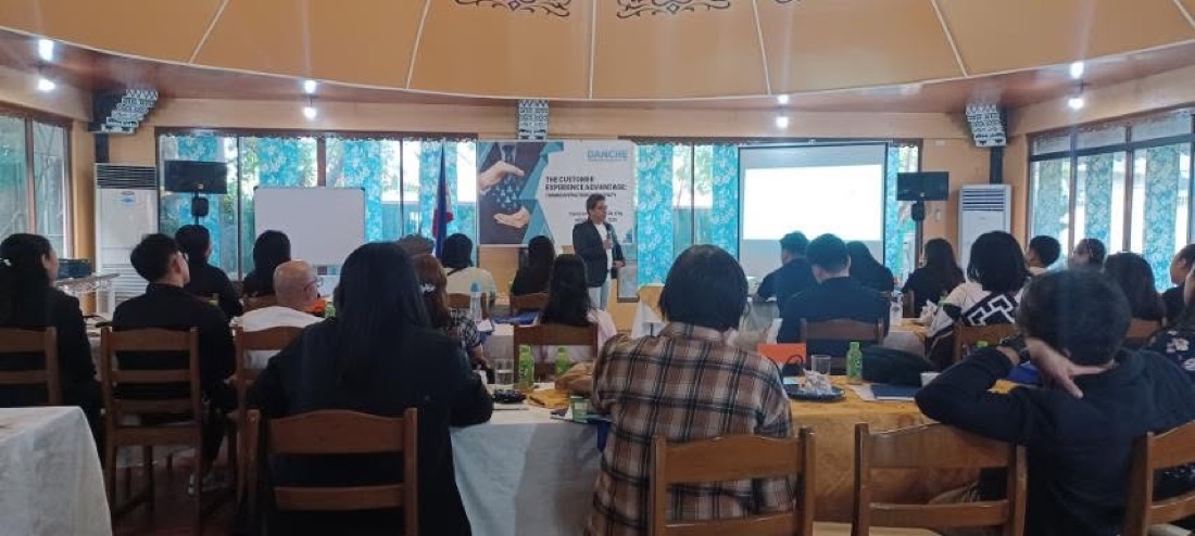 Full-room wide shot of a DANCHE training in session
